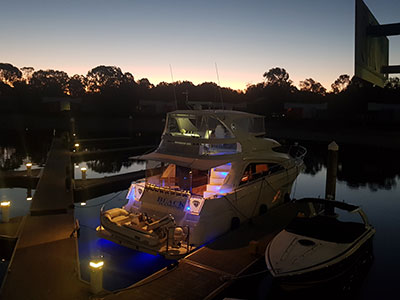 Stern of Black Diamond moored at night