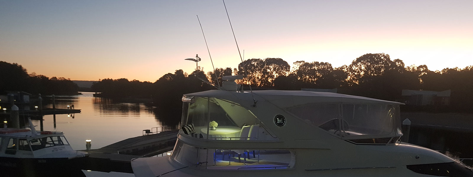 Sky Lounge of Black Diamond motor yacht moored at night